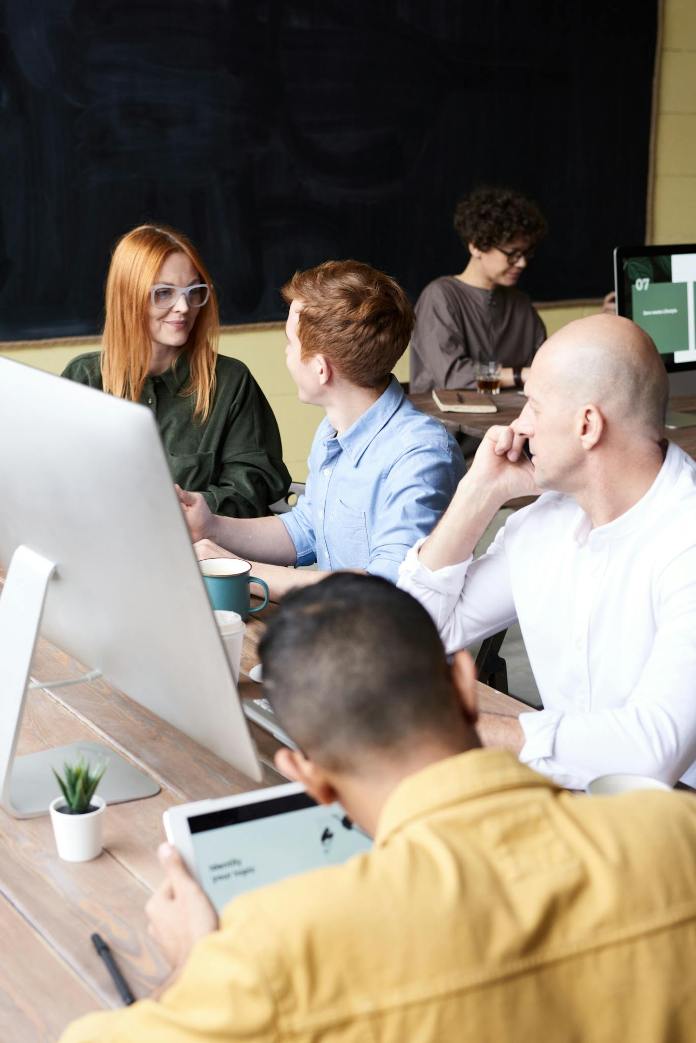 Group of People Sitting Indoors